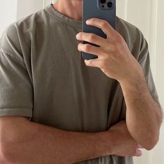 a man taking a selfie with his cell phone