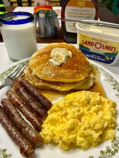 pancakes, sausages and eggs are on a plate