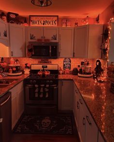 a kitchen decorated for halloween with lights and decorations