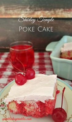 a piece of poke cake on a plate with cherries