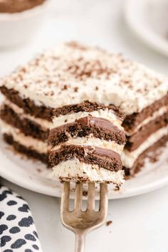 a piece of cake is being held by a fork