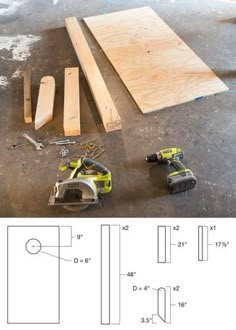 some tools are laying on the floor next to wood planks and plywood boards