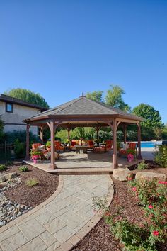 a gazebo sitting in the middle of a garden