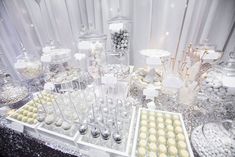 a table topped with lots of desserts and candies