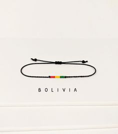 Dainty bracelett with the National Flag of Bolivia. Choose your desired style from two ones displayed in photo #2. Need a flag of another country? Almost all countries of the world are available. Feel free to ask us. We can add up to 3 flags on one bracelet. Our bracelets are extremely comfortable to wear - no rubbing and no pressure points. You may wear this national flag bracelet all day, every day. DETAILS - The highest quality Japanese glass seed beads 2 mm - Strong nylon string, black by default or colorful by your request - 2 styles are available - Waterproof, but avoid perfume and lotions - This bracelet is lightweight and extremely comfortable to wear 24/7 - Comes in a small beautiful packaging. You can also update the standard packaging to the gift box when checkout. The shipping Casual Rectangular Jewelry For Gift, Casual Black Friendship Bracelets For Gift, Rectangular Casual Jewelry For Everyday, Casual Rectangular Jewelry For Everyday, Casual Rectangular Everyday Jewelry, Casual Resizable Wristband As Gift, Minimalist Multicolor Bracelet As A Gift, Minimalist Multicolor Bracelet For Gift, Minimalist Multicolor Bracelets As Gifts