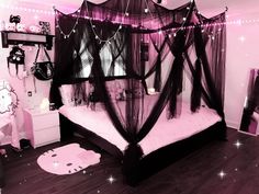 a bedroom decorated in pink and black with lights strung from the ceiling, bed frame