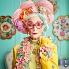 an older woman with pink glasses and flowers in her hair wearing a yellow dress, floral headpiece