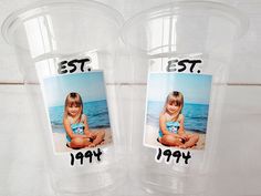 two plastic cups with photos on them