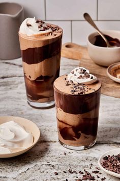 two glasses filled with ice cream and chocolate