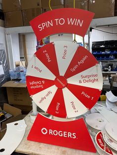 a spin to win sign sitting on top of a table