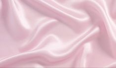 a close up view of a pink satin fabric