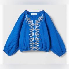 Nwt Zara Girl Embroidered Blouse With Subtle Ruffles On The Neckline And Elastic Hem And Cuff Size 6y Excellent Condition Blue Embroidered Long Sleeve Top, Blue Long Sleeve Embroidered Tops, Blue Embroidered Long Sleeve Peasant Top, Blue Long Sleeve Peasant Top With Floral Embroidery, Organza Blouse, Girls Crop Tops, Gingham Tops, Zara Girl, Zara Shirt