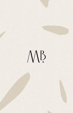 the word m b is written in black ink on a white background with small circles