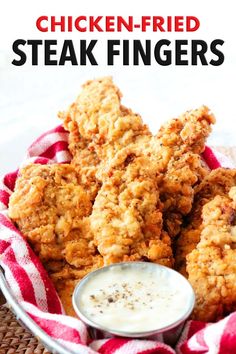 chicken - fried steak fingers with ranch dip in a bowl on a red and white checkered cloth