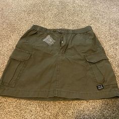 Never Been Worn, Tags And Spare Button Included. Perfect Condition. Many Pockets On The Military-Style Khaki Mini Skirt From Urban Outfitters. Casual Khaki Mini Skort, Urban Outfitters Casual Mini Skirt, Casual Khaki Lined Skirt Bottoms, Casual Lined Khaki Skirt, Casual Khaki Lined Skirt, Casual Khaki Cotton Skort, Casual Khaki Mini Skirt, Casual Cotton Cargo Skirt With Button Closure, Casual Green Mini Skirt With Pockets