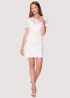 Elevate your spring-summer wardrobe with our enchanting white Magnolia Dreams Mini Dress. Effortlessly combining classic charm with modern sophistication, this dress is a must-have for any occasion. Feminine lace fabrication adds a touch of romance, while the short sleeves offer a breezy and comfortable fit for warm days and balmy evenings. The dress is fully lined with a light stretch on the fabric, making it comfortable to wear. WDWH13132 Imported 60% Cotton, 32% Nylon, and 8% Spandex. Model i Spring Brunch Mini Dress With Delicate Lace, Spring Mini Dress With Delicate Lace For Brunch, White Fitted Crochet Dress With Lace Sleeves, Fitted White Crochet Dress With Lace Sleeves, White Lace Top Mini Dress, Elegant Spring Crochet Dress With Delicate Lace, Elegant Crochet Dress With Delicate Lace For Spring, Chic White Mini Dress With Lace Top, White Mini Dress With Lace Top, Chic Style