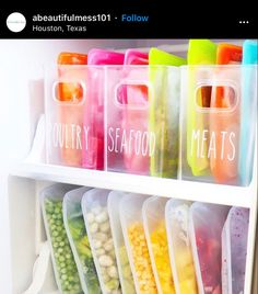 a refrigerator filled with lots of different types of food in plastic bags and bins