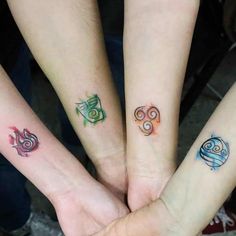 three people with matching tattoos on their hands