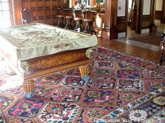 an ornately decorated bed in the middle of a room