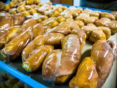 there are many donuts that are on the trays and ready to be eaten