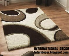 an area rug with brown and white circles on it in the middle of a living room