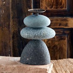 a stack of rocks sitting on top of a wooden table