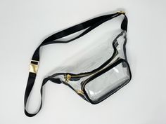 The perfect clear stadium-approved belt bag for game days, concert nights, and all the other events you've got tickets to. Wear it across the shoulder or on the waist, so your hands are free to cheer and dance all day.  - Adjustable strap: total circumference adjustable from 45-63 inches (114-160 cm) - Bag size: approximately 12 x 7 inches (31 x 18 cm) - Gold metal buckle, adjuster, and zippers  - Durable clear PVC - Faux leather trim in red and black Cheer And Dance, Clear Belt, Hip Bag, How To Make Shorts, Waist Bag, Cute Bag, Metal Buckles, Fun Bags, Bag Straps