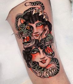 a woman's arm with tattoos on it and an image of two cats in the middle