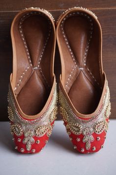 Introducing our stunning red Punjabi juttis, where elegance meets vibrancy! Crafted with intricate details and adorned with bold red hues, these juttis are a perfect blend of tradition and modern style. Whether you're a bride looking for a statement piece to complement your wedding attire or a fashion enthusiast seeking to add a pop of color to your ensemble, these red juttis are sure to captivate hearts. Step into sophistication and grace with our collection of red Punjabi juttis. #RedJuttis #PunjabiFootwear #BridalAccessories #IndianFashion #EthnicFootwear #WeddingEssentials" Reception Bridal Dress, Punjabi Jutti, Bridal Wedding Shoes, Leather Footwear, Embroidered Leather, Fashion Enthusiast, Wedding Essentials, Womens Wedding Shoes, Bride Look