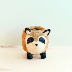 Clever and curious, this raccoon planter adds a touch of black-and-white whimsy into any home. Handcrafted by artisan communities in a fair trade environment. Each purchase empowers artisan communities in the Philippines. Handwritten Gifts, Natural Baskets, Animal Planters, Handmade Plant, Art Phone Cases, Cozy Gift, Sustainable Gifts, Clutch Pouch