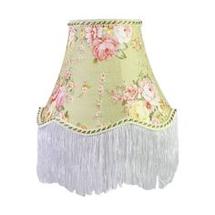 a green lamp shade with pink flowers and white fringes on the bottom is shown