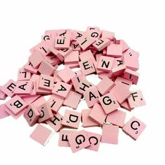 pink scrabbles with letters and numbers on them