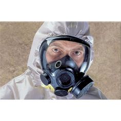 a man wearing a gas mask and protective suit