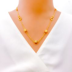 Crafted from 22k gold and weighing 9.0 grams, this necklace features a striking striped block design in a luminous yellow gold finish. The piece measures 18 inches in length, with an additional 1 inch of adjustable links for a customizable fit, secured with an S lock. This design merges the boldness of geometric shapes with the classic elegance of gold, offering a unique and sophisticated accessory. Ideal for those seeking a statement piece that combines contemporary style with timeless luxury, this necklace is perfect for elevating any ensemble with its distinctive charm and refined appearance. PRODUCT DETAILS Gold Purity(karat): 22k Gold Weight(grams): 9.0 Item Finish: Yellow Gold Necklace Length: 18" Adjustable Links: 1" Links Lock Style: S Lock Elegant 22k Gold Yellow Chain Necklace, Elegant 22k Gold Necklace With Adjustable Chain, 16 Inch Yellow Gold Plated Chain Necklace, 22k Gold Necklace With Adjustable Chain, Elegant 22k Gold Plated Necklaces, Elegant 22k Gold Necklaces, 22k Gold Necklace, Lock Style, Timeless Luxury