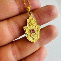 Gold Hamsa Hand Necklace with Tourmaline Gemstone, 925 Sterling Silver Hand Amulet Necklace, Talisman for Protection, Evil Eye, Gift for Her Hamsa Hand Amulet 🧿 The Hamsa hand necklace is a timeless symbol of protection, power, and good fortune. With roots in ancient Middle Eastern cultures, this exquisite piece of jewelry features an open hand, often adorned with intricate designs and gemstones.  The eye embedded in the palm wards off evil, while the five fingers represent the five senses and Engraved Spiritual Healing Jewelry, Engraved Spiritual Necklaces For Healing, Spiritual Sterling Silver Charm Necklace With Gemstone, Birthstone Medallion Amulet Jewelry, Birthstone Medallion Amulet, Spiritual Birthstone Jewelry For Good Luck, Engraved Amulet Jewelry For Good Luck, Healing Birthstone Amulet Jewelry, Amulet Style Gemstone Pendant Charm Necklaces