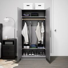 an open closet with clothes and shoes in it