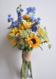 a bouquet of sunflowers, blue and yellow flowers