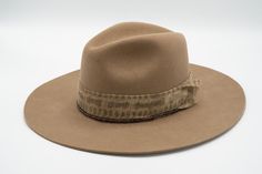 “Imagine.  What you are seeking is seeking you.”   --Camel Fedora— 200 Gram Argentine Wool Felt Mudcloth Glass trade beads Leather Sweatband   Brim Width: 3.25" Crown Height: 5"  S (55cm)  M (57-58cm)  L (59cm)  XL (61cm) Don't know your size? Check out our Sizing Guide. Mens Inspo, Crown Heights, East Bay, Trade Beads, Bead Leather, Mud Cloth, Fedora