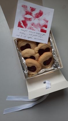 a box filled with cookies sitting on top of a table