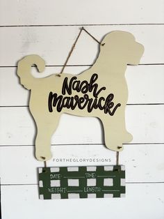 a wooden sign that says nach mavrickk with a dog on it