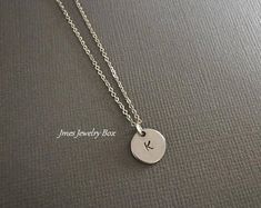 I really like this! Simple Initial Pendant Charm Necklaces, Minimalist Stainless Steel Initial Necklace For Everyday, Silver Minimalist Personalized Initial Necklace, Everyday Stainless Steel Initial Necklace, Minimalist Personalized Round Disc Charm Necklaces, Minimalist Round Disc Charm Necklace For Personalized Gift, Minimalist Round Hand Stamped Charm Necklaces, Minimalist Stainless Steel Charm Necklaces, Minimalist Stainless Steel Charm Necklace