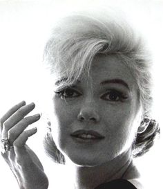 a black and white photo of a woman with blonde hair