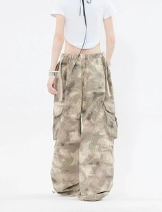 Embrace the street aesthetic with our Faded Baggy Camo Cargo Pants, perfect for making a statement while on the move.
Designed with a natural waist, these cargo pants offer a blend of comfort and durability. The camouflage pattern adds an edgy touch, while the drawstring and convenient pockets provide functionality and ease. The relaxed wide-leg silhouette ensures a nonchalant yet purposeful style, tailored for the contemporary wardrobe.
Pair them with a cropped hoodie and sneakers for running e Spring Cotton Combat Cargo Pants, Summer Cargo Pants With Hip Pockets For Streetwear, Summer Streetwear Cargo Bottoms, Summer Streetwear Khaki Cargo Pants, Spring Combat Cotton Cargo Pants, Summer Khaki Cargo Pants For Streetwear, Summer Cargo Style Bottoms For Streetwear, Summer Streetwear Pants With Multiple Pockets, Summer Streetwear Cargo Pants With Cargo Pockets