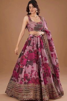 Famous designers tend to give reign to their imagination and create clothes that look interesting and guided by the desire to attract attention. Real beauty comes out from your dressing style with this organza lehenga choli. This attire is beautifully adorned with embroidered and fancy work work. Comes with matching choli and dupatta.