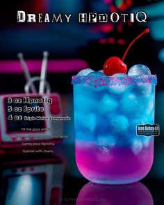 a blue and purple drink with a cherry on top