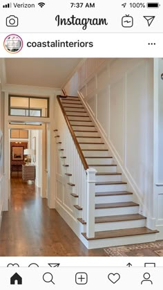 a staircase leading up to the second floor in a house with white walls and wood floors