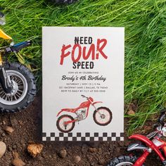 a birthday card with a dirt bike and motorbike on the ground next to it