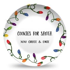 a white plate with christmas lights on it that says cookies for santa, xoxo grace & eme