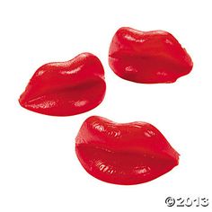 three pieces of red lipstick sitting on top of each other