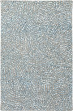 a blue and white rug with small dots on it